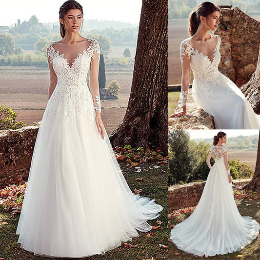 Elegant Illusion Long Sleeve Lace Wedding Dress with Cathedral Train.