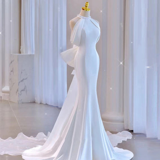 Modern Halter Satin Mermaid Wedding Dress with Dramatic Back Bow.