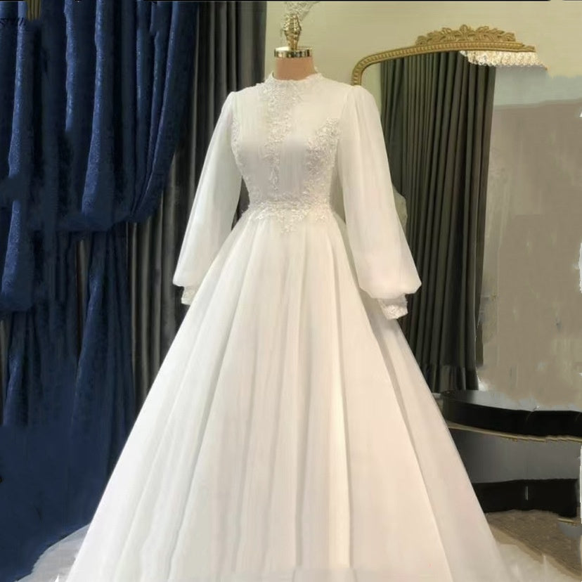 White Satin Long Sleeve Raglan Wedding Dress with Full Tutu Skirt.