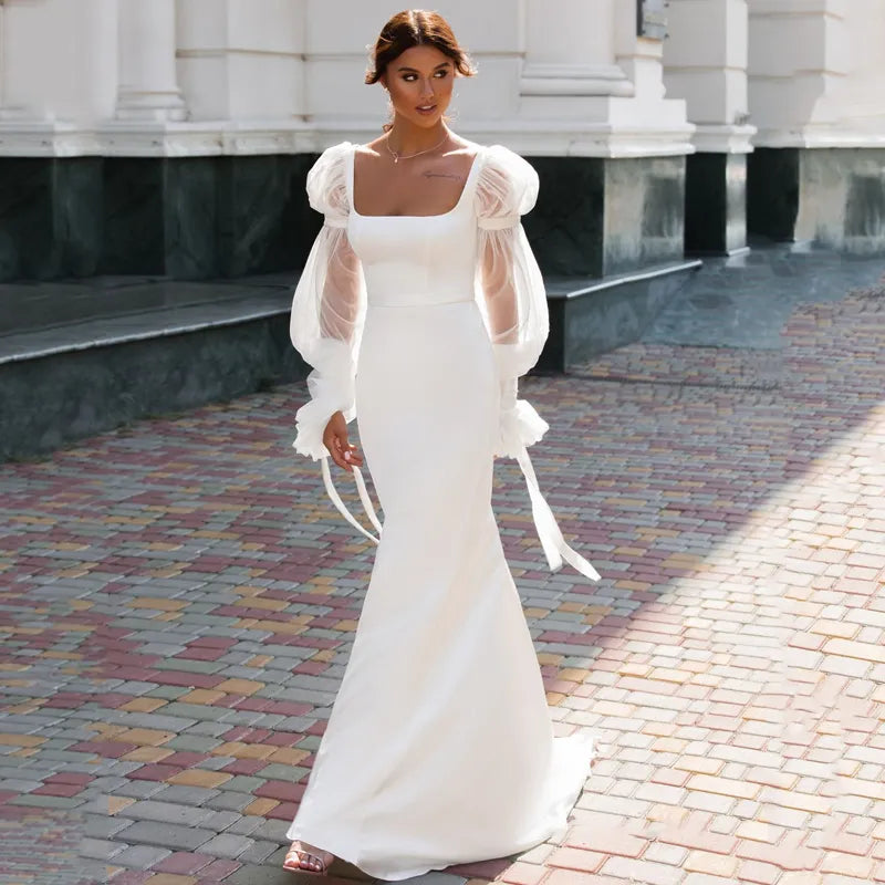Elegant Off-the-Shoulder Lace Long Sleeve Mermaid Wedding Dress.