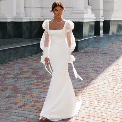 Elegant Off-the-Shoulder Lace Long Sleeve Mermaid Wedding Dress.