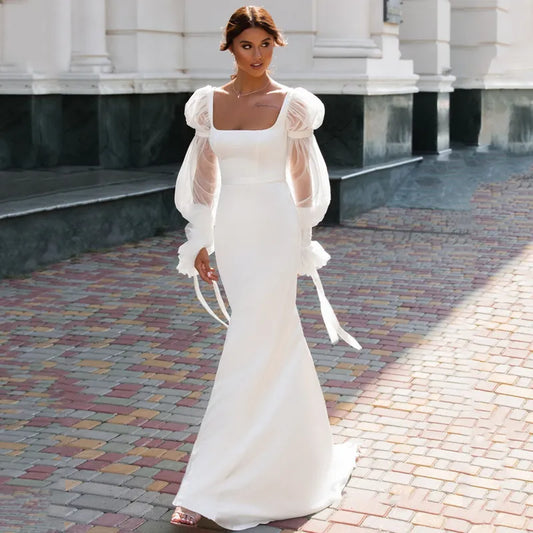 Elegant Off-the-Shoulder Lace Long Sleeve Mermaid Wedding Dress.