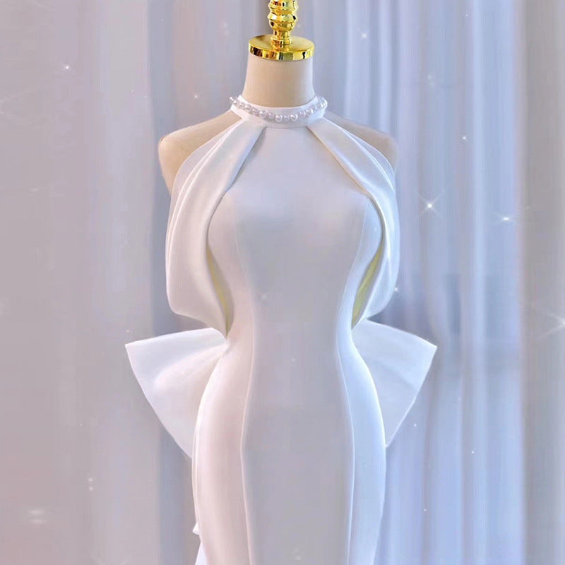 Modern Halter Satin Mermaid Wedding Dress with Dramatic Back Bow.